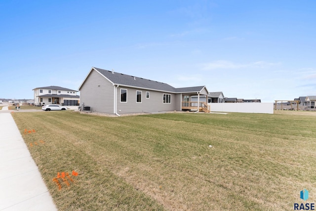 rear view of house with a lawn