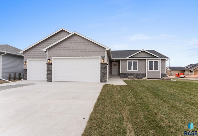 view of front facade with a front yard and a garage