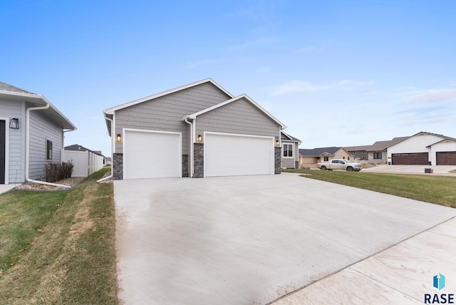 view of front of property featuring a front lawn and a garage