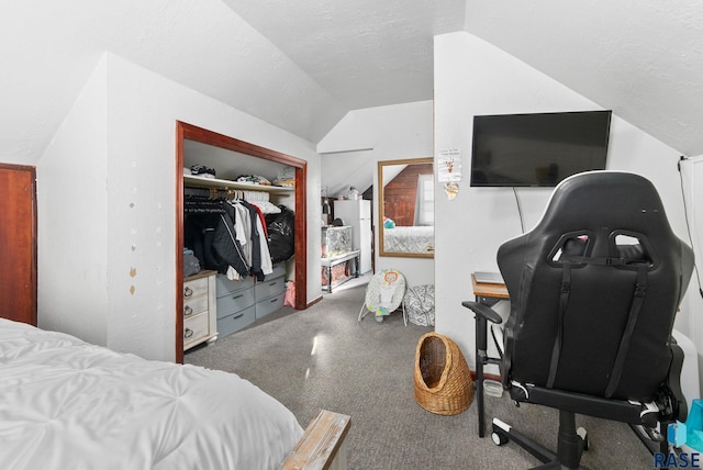 bedroom featuring a textured ceiling, a closet, carpet, and vaulted ceiling