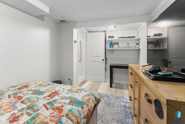 bedroom with light wood-type flooring