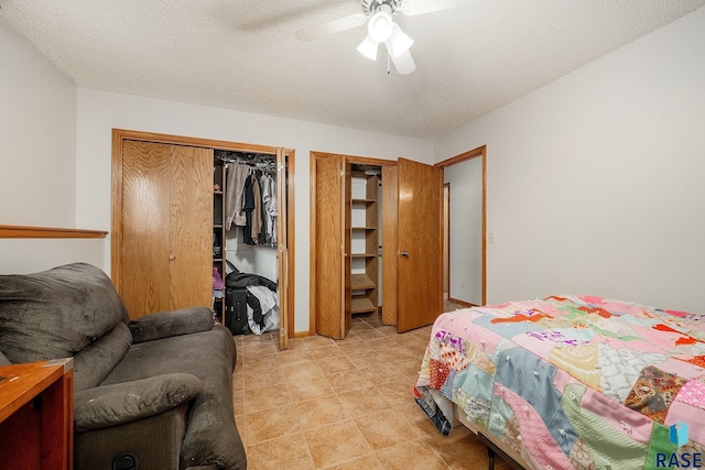 bedroom with ceiling fan and a textured ceiling