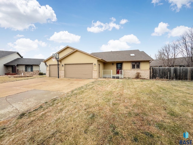 single story home with a garage and a front lawn