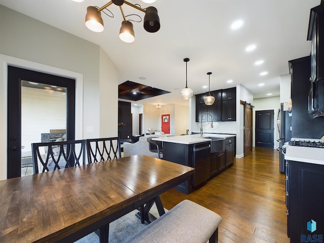 dining room with dark hardwood / wood-style flooring and sink