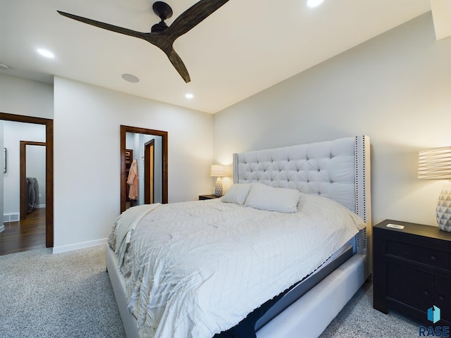 bedroom featuring washer / dryer, carpet floors, and ceiling fan