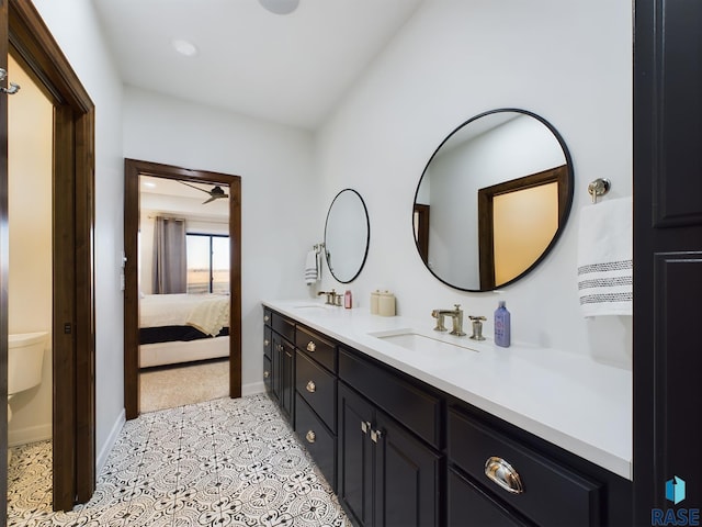 bathroom with ceiling fan, tile patterned flooring, and vanity