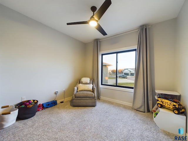 playroom featuring ceiling fan and carpet floors