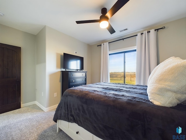 carpeted bedroom with ceiling fan