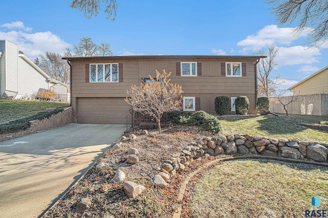 view of front of property featuring a garage and a front yard