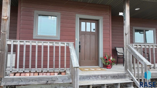 doorway to property featuring covered porch