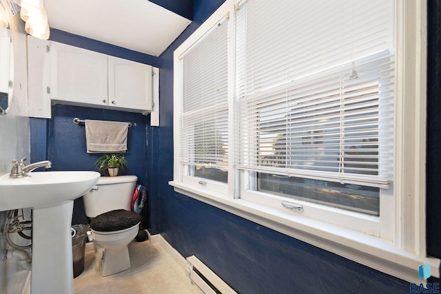 bathroom with tile patterned flooring, toilet, and sink