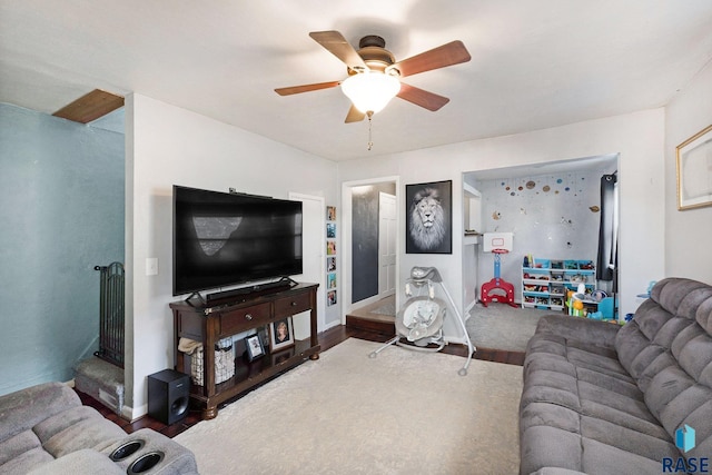 living room with ceiling fan and wood-type flooring