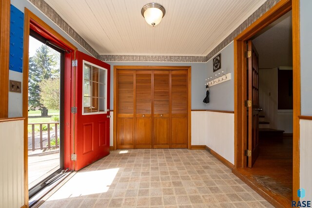 interior space featuring wood walls