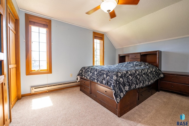 carpeted bedroom featuring baseboard heating, multiple windows, ceiling fan, and lofted ceiling