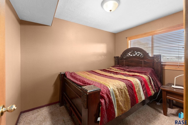 carpeted bedroom with vaulted ceiling