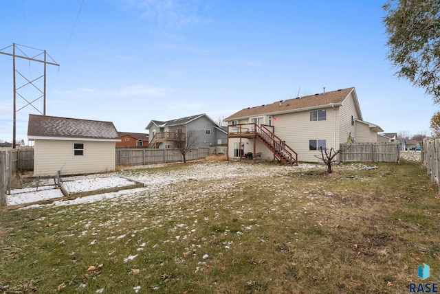 view of yard with an outdoor structure and a wooden deck