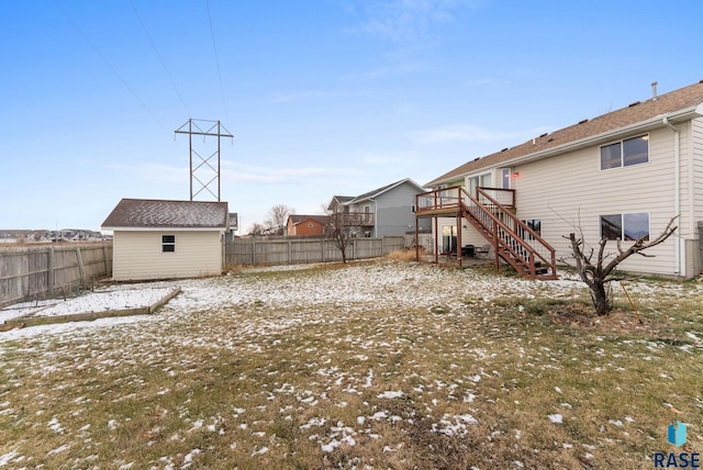 view of yard with an outbuilding and a wooden deck