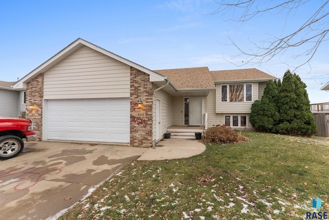 view of front facade with a front yard and a garage