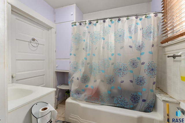 bathroom featuring tile patterned floors, shower / bath combo, and vanity