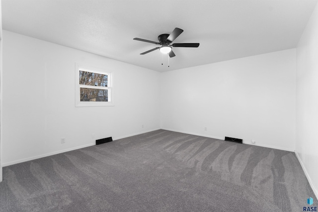 empty room featuring carpet flooring and ceiling fan