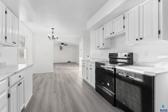 kitchen with black appliances, ceiling fan with notable chandelier, white cabinets, and light hardwood / wood-style flooring