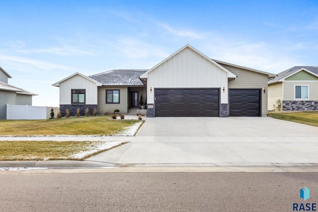 view of front of house with a garage and a front yard