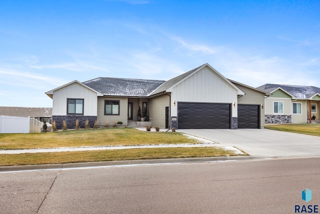 view of front facade with a front yard and a garage