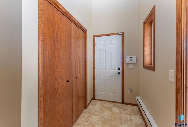 doorway with a baseboard heating unit