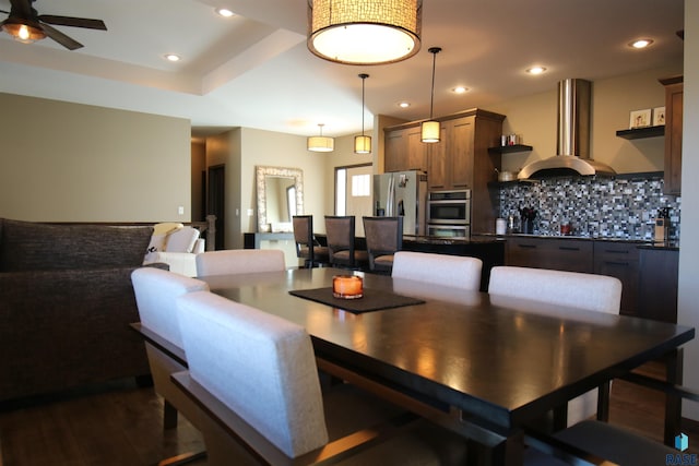 dining area featuring a ceiling fan, recessed lighting, and dark wood-style flooring