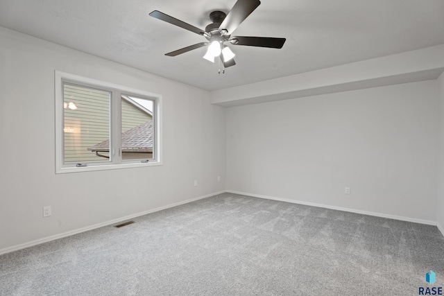 spare room with carpet flooring and ceiling fan