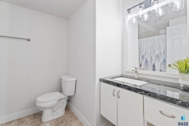 bathroom featuring walk in shower, tile patterned floors, a textured ceiling, toilet, and vanity