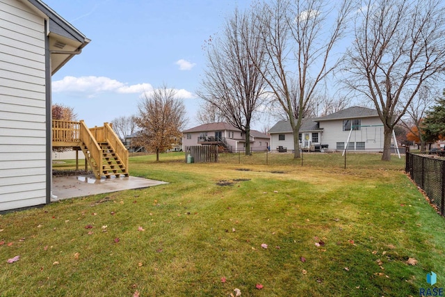 view of yard with a deck and a patio area