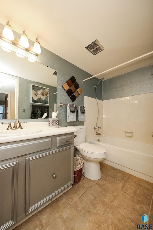 full bathroom featuring toilet, tile patterned floors, vanity, and bathtub / shower combination