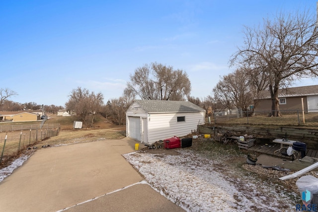 exterior space with a garage and an outdoor structure