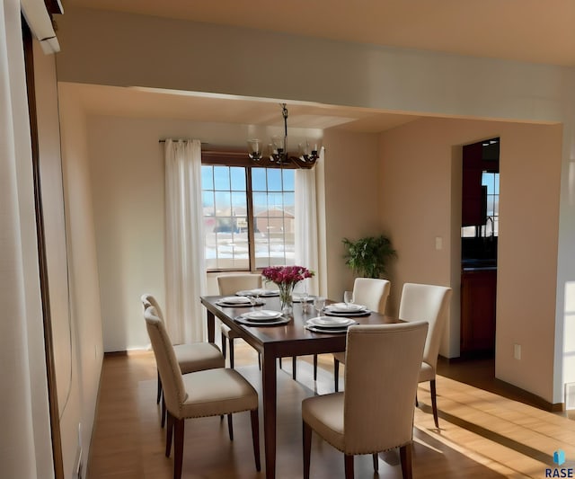 dining room featuring a chandelier and hardwood / wood-style floors