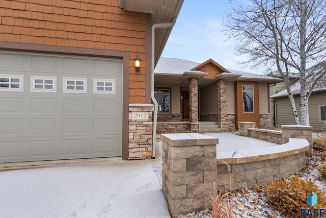 view of exterior entry with a garage