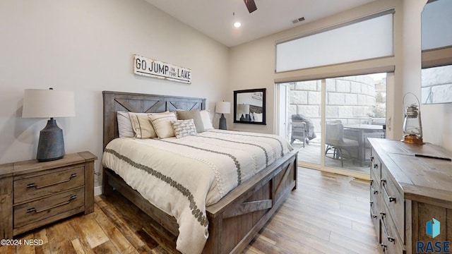 bedroom featuring ceiling fan, light wood-type flooring, and access to outside