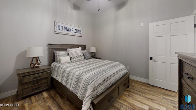 bedroom featuring hardwood / wood-style flooring and ceiling fan