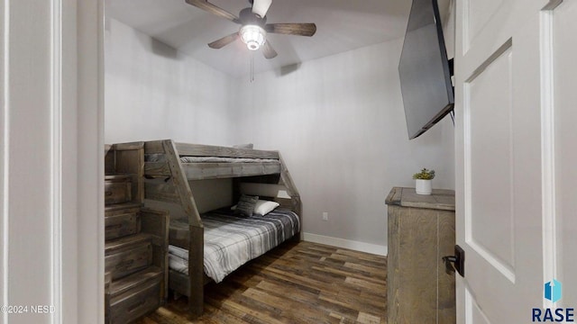 bedroom with ceiling fan and dark hardwood / wood-style flooring