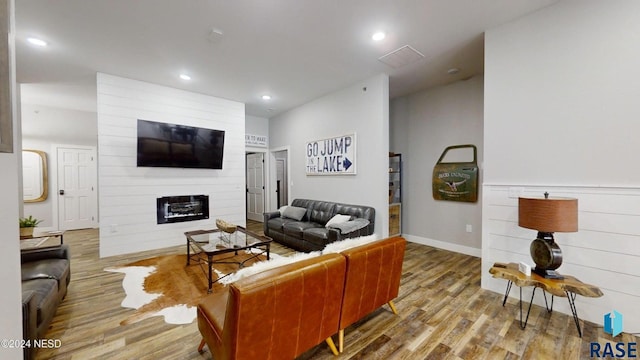 living room featuring a fireplace and hardwood / wood-style flooring