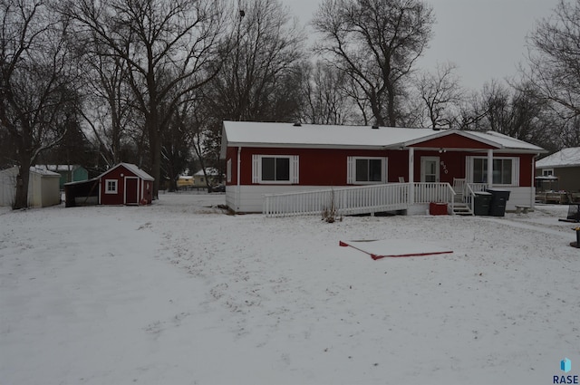 view of front of home with a shed