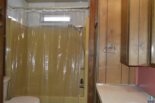 full bathroom featuring vanity, toilet, and shower / bathtub combination with curtain