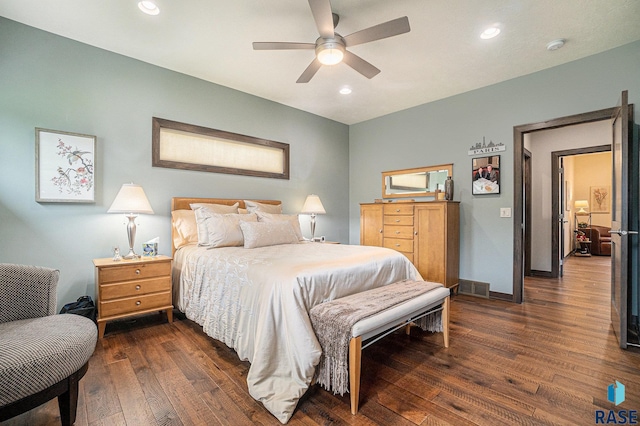 bedroom with ceiling fan and dark hardwood / wood-style floors