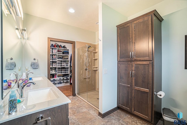 bathroom with vanity and an enclosed shower