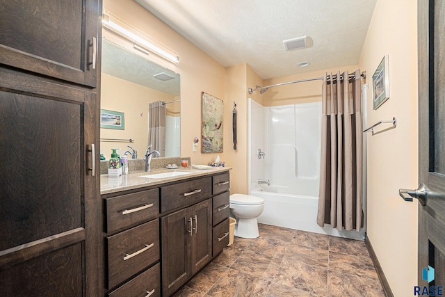 full bathroom featuring vanity, shower / bath combination with curtain, a textured ceiling, and toilet