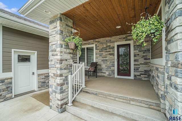 view of exterior entry featuring a porch