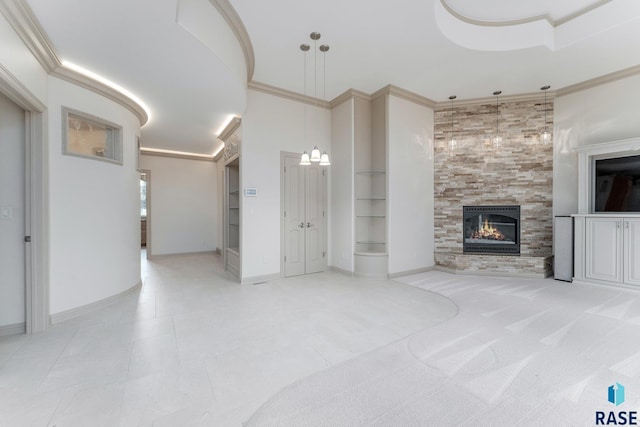 unfurnished living room with a tile fireplace, light tile patterned floors, and ornamental molding