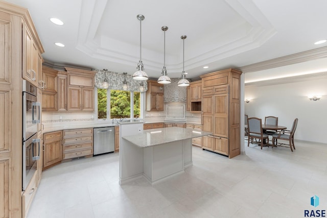 kitchen with a raised ceiling, light stone countertops, decorative light fixtures, a kitchen island, and stainless steel appliances