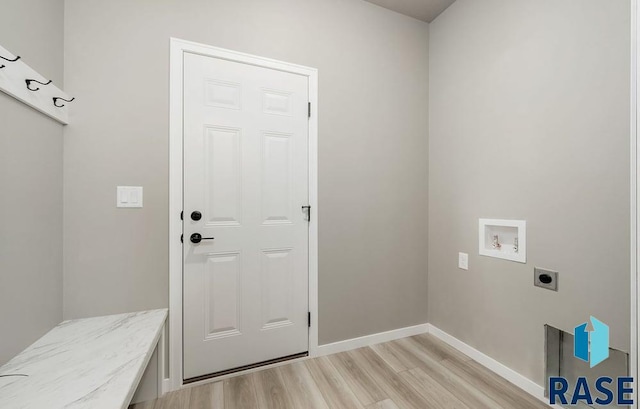 washroom with washer hookup, electric dryer hookup, and light hardwood / wood-style floors