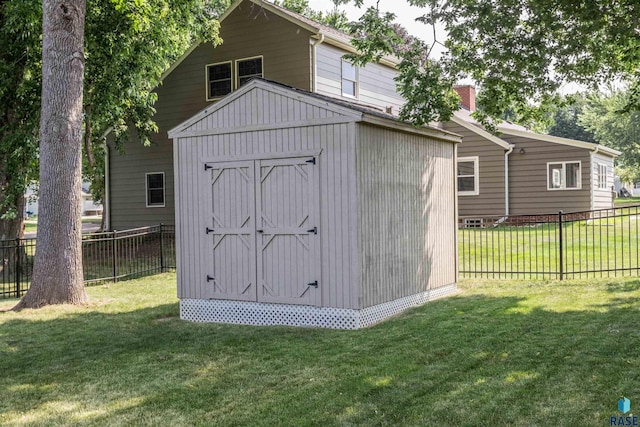 view of outdoor structure with a lawn